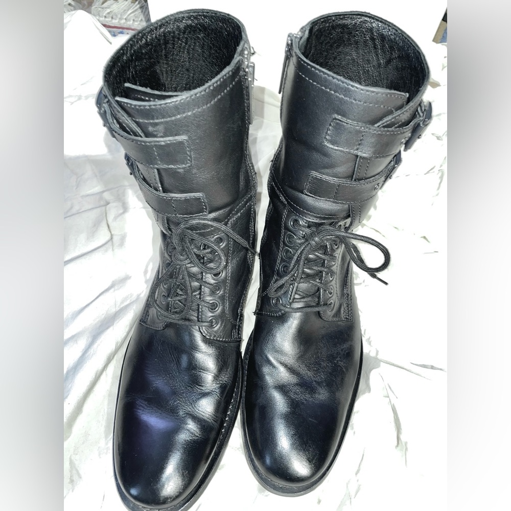 One pair Kenneth Cole black leather boots, size 9. Ankle with side zipper.